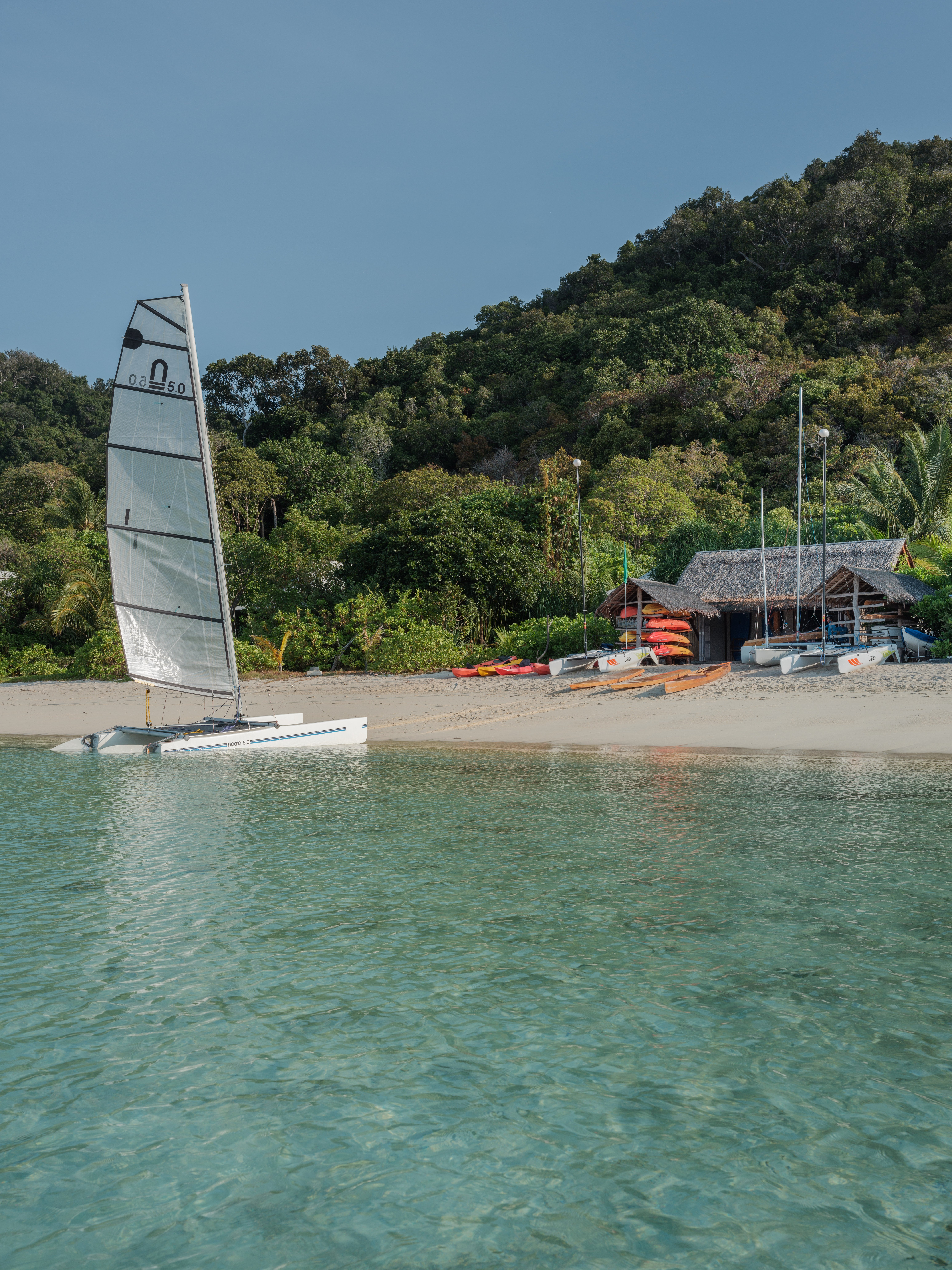 Bawah Reserve activities centre with paddle boards and kayaks for guests use