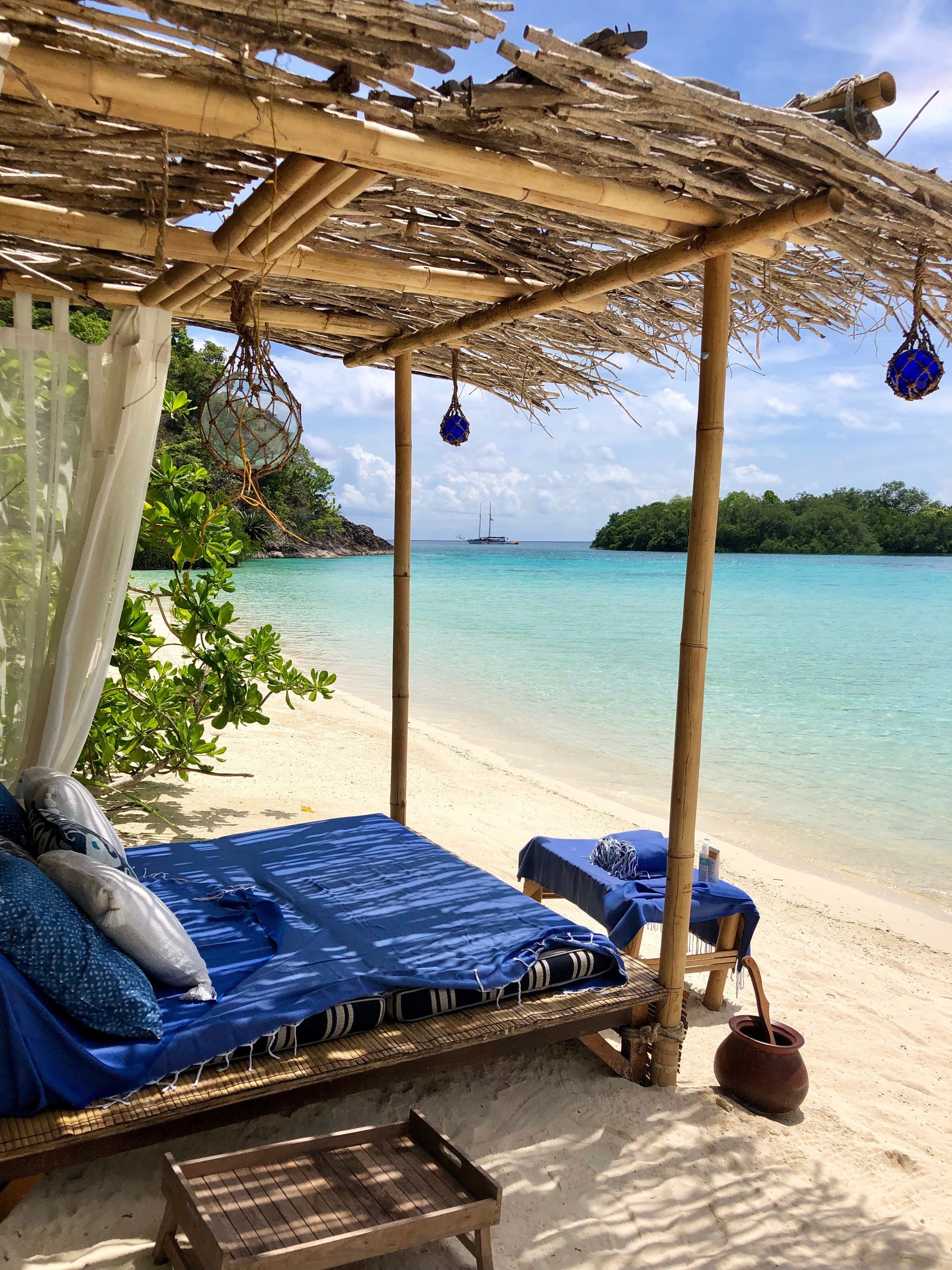add some elements of surprise to your honeymoon like a picnic on a private island beach