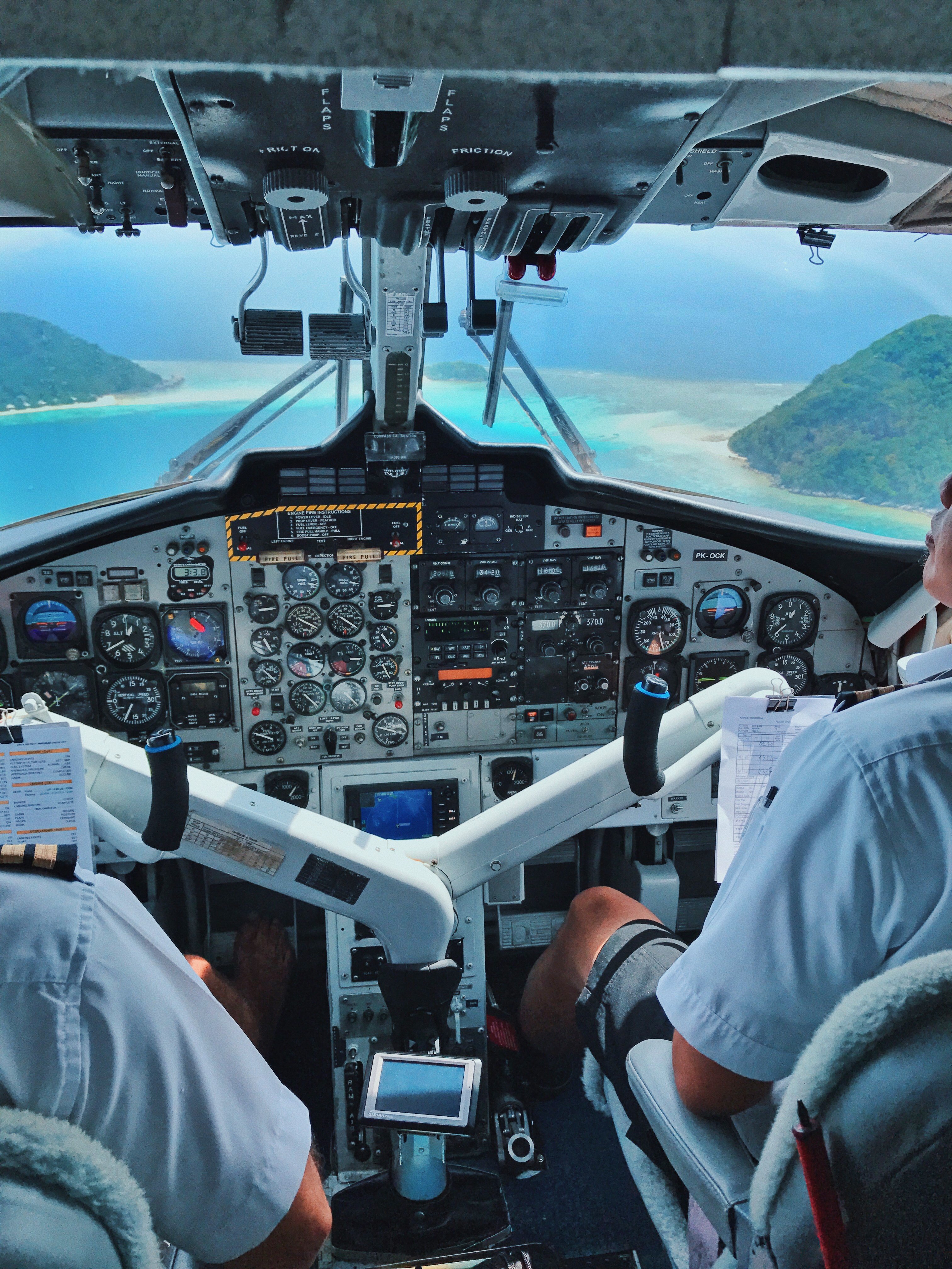 Seaplane pilots enroute to Bawah Reserve, private island resort, Indonesia