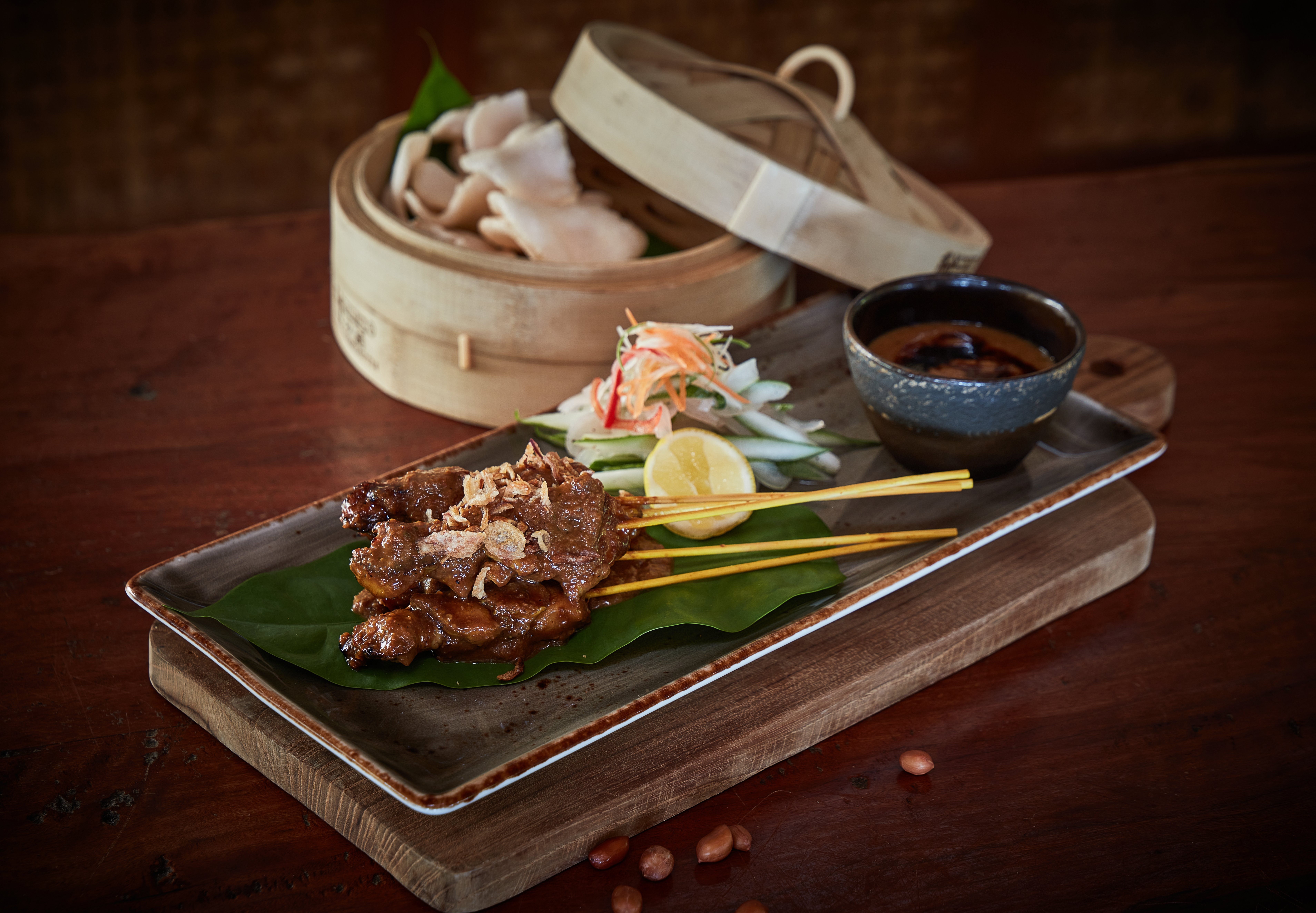 grilled_satay_and_peanut_sauce_served_with_pickles_and_crackers_treetops